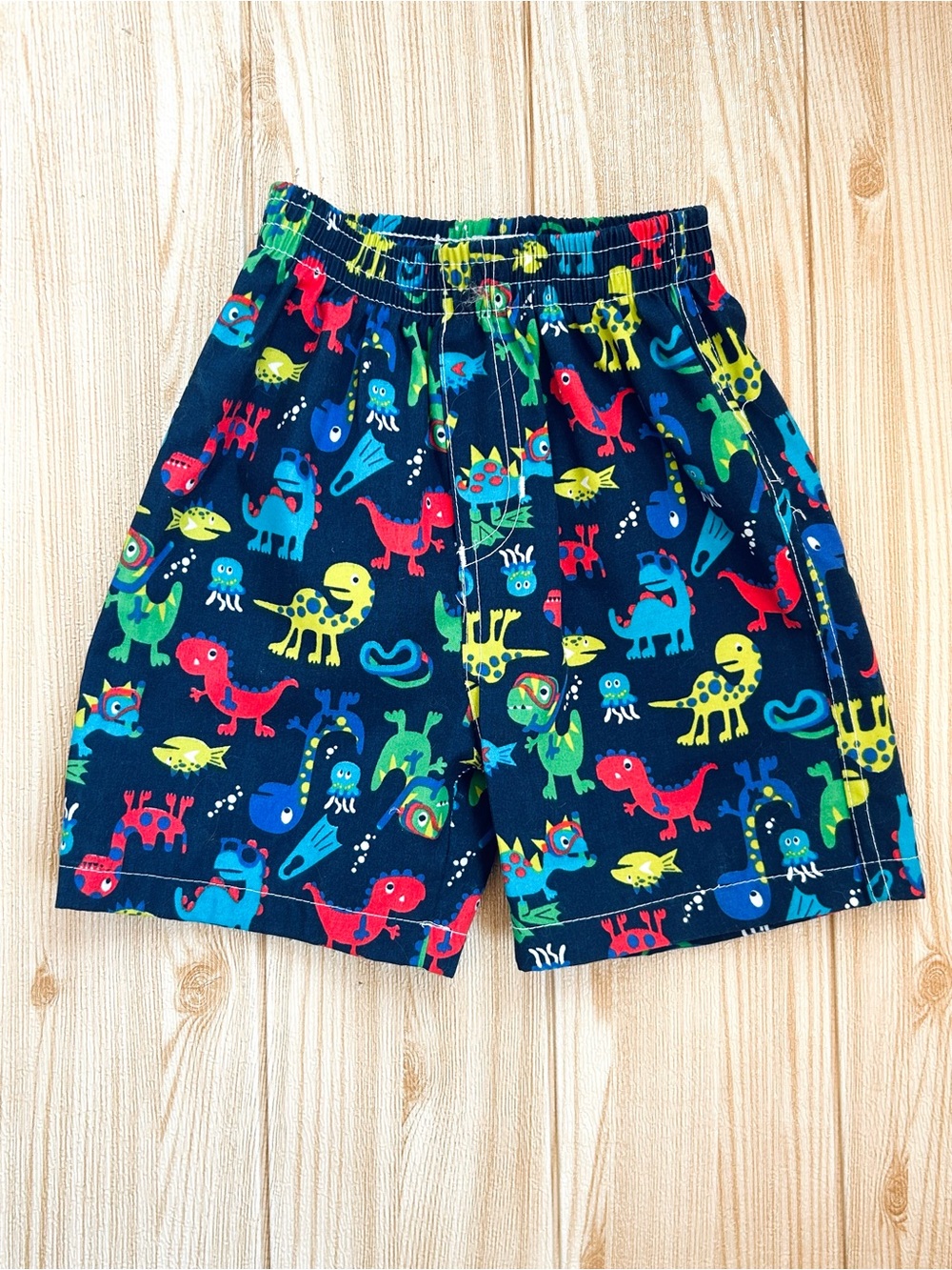 Boys sz 2T / 24 M Navy Blue Swim Trunks Shorts Dinosaur